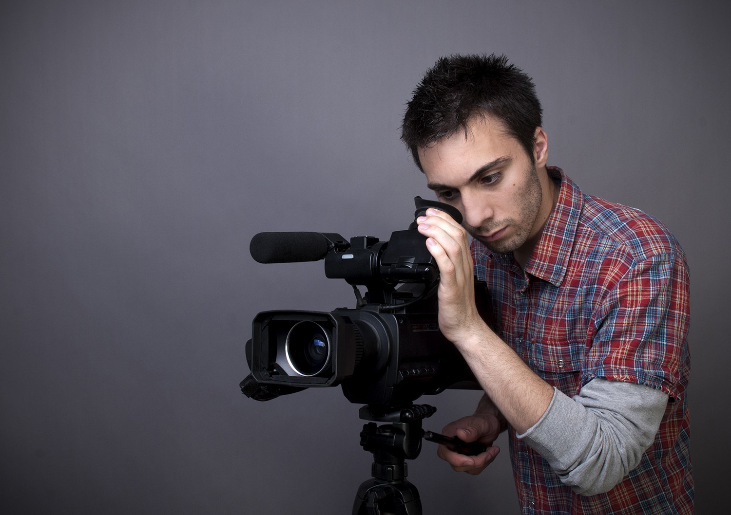 Young man with video camcorder